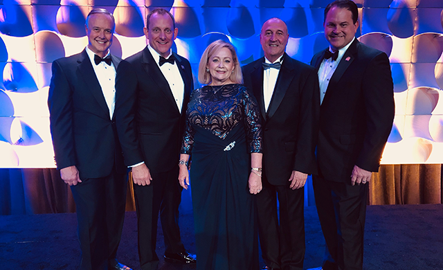 The 2020 Leadership Team of Cindi Bulla, Travis Kessler, Marvin Jolly, Russell Berry, and Tray Bates pose before the Installation Dinner at the 2019 Texas REALTORS® Conference in Fort Worth.