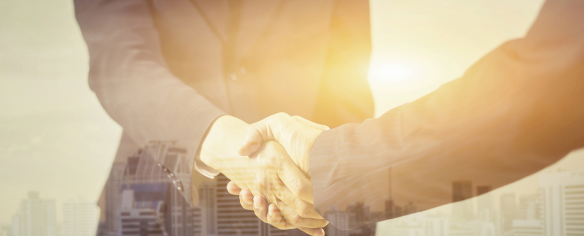 Closeup of two people shaking hands