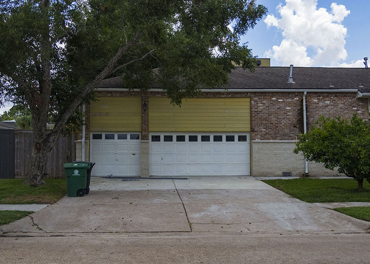 An elevated Meyerland home shows the space where the garage was when the house was at ground level