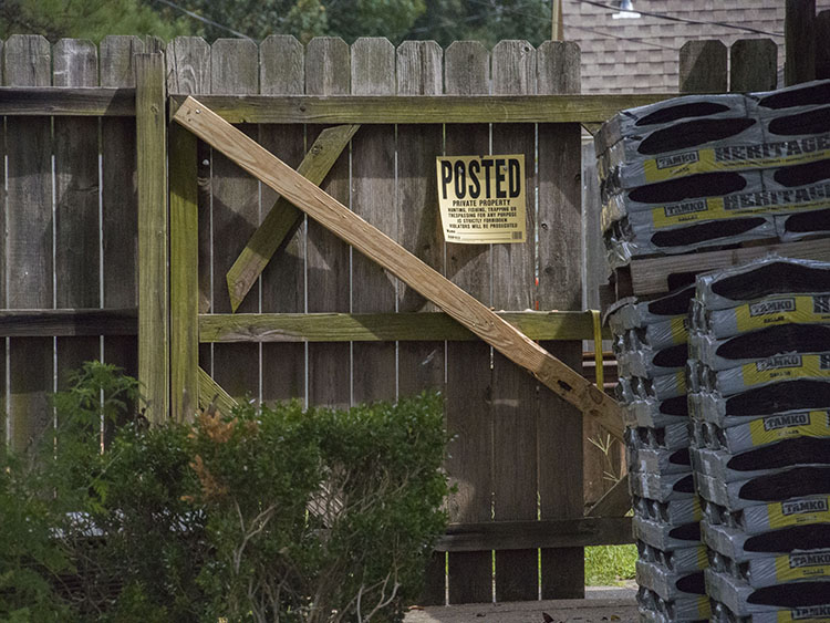 A Vidor home being rebuilt has a no trespassing sign posted on the fence.