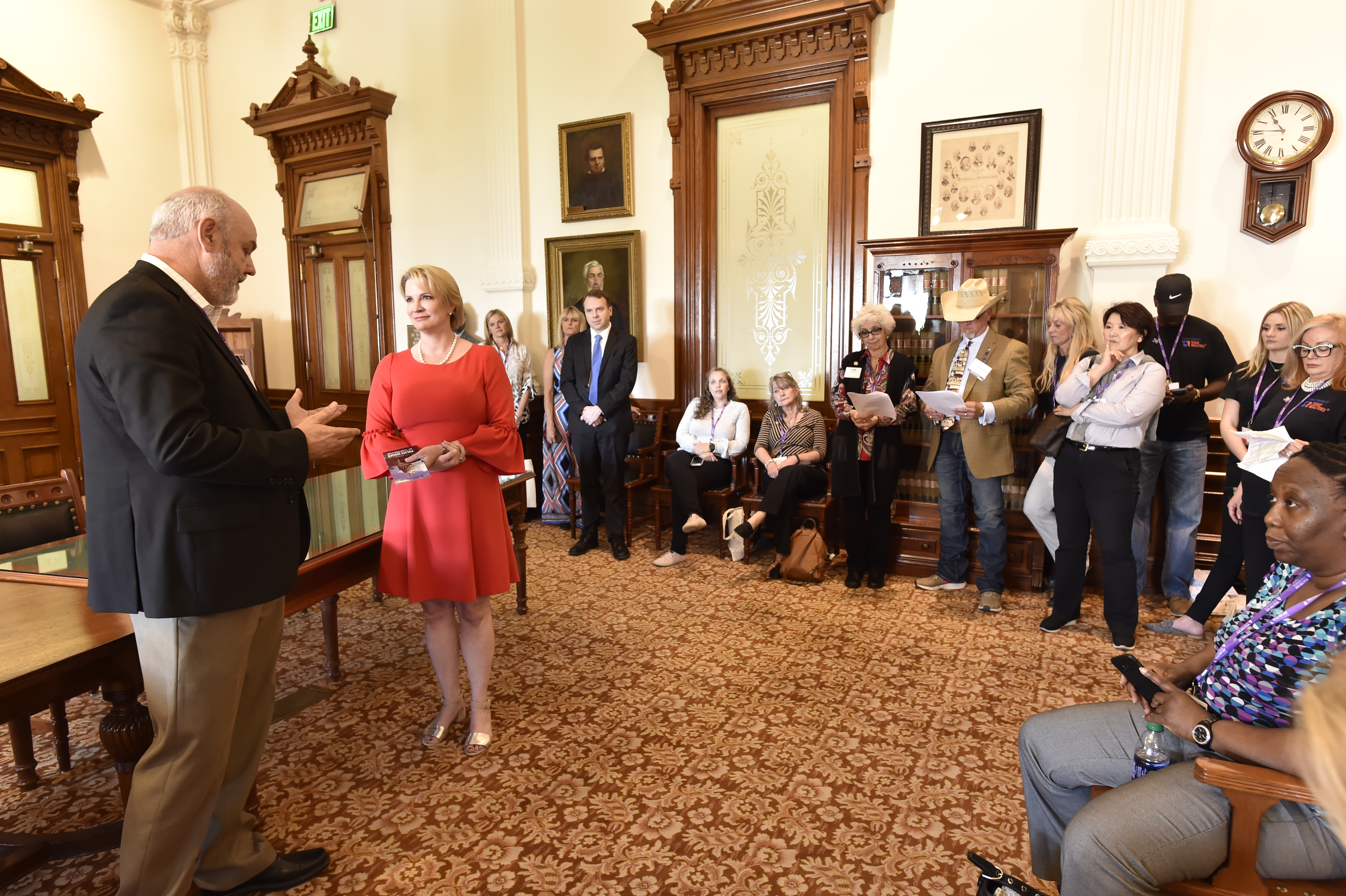 Senator meeting with a room full of constituents at the Texas Capitol