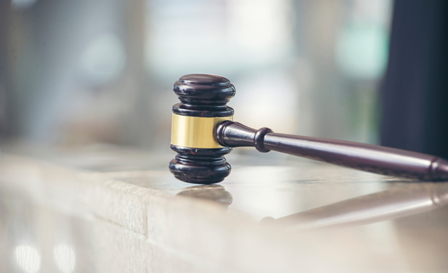 gavel isolated on wooden table