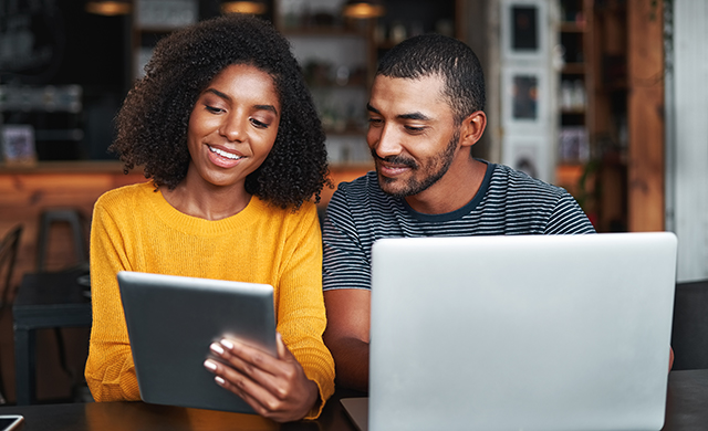 couple using laptop