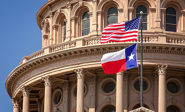 flags outside Texas Capitol