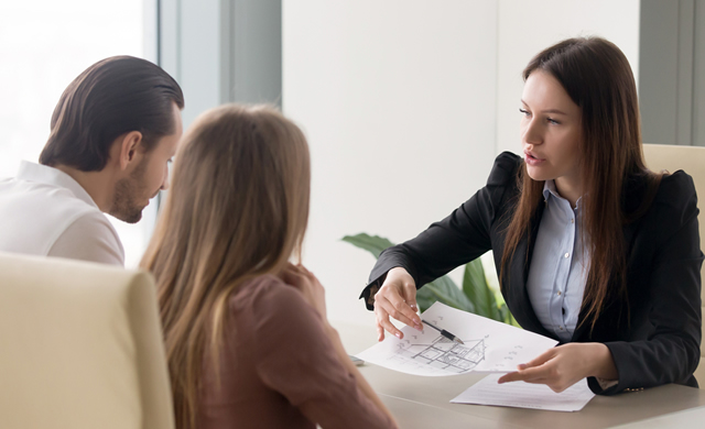 female agent presenting to couple